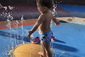 child playing on water slide